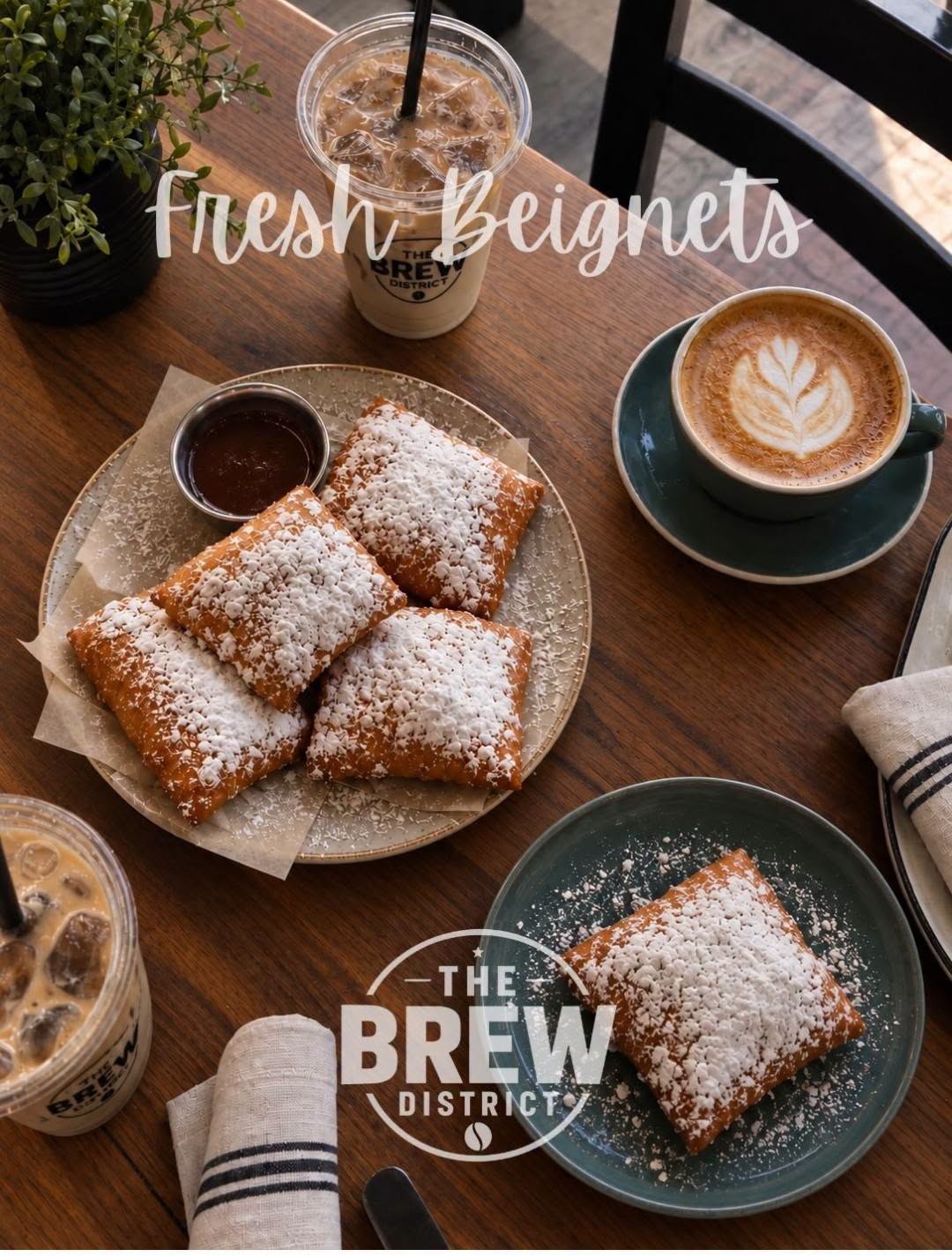 Fresh Beignets — The Brew District. Powdered-sugar beignets served with coffee and chocolate sauce.